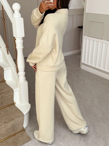 Women's two-piece casual set featuring long sleeve top and wide-leg trousers in beige