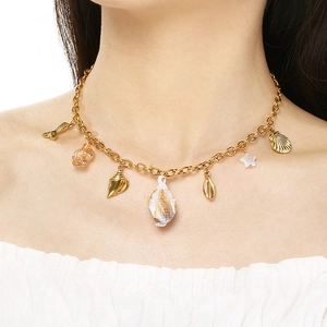 Detailed close-up of gold shell, starfish and fish tail pendants on a summer ocean necklace