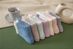Set of 7 colorful fuzzy coral fleece crew socks in soft pastel shades for winter warmth