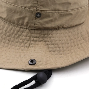 Detailed close-up of khaki sun hat featuring durable stitching and metal side snaps
