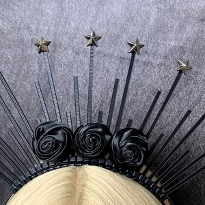 Gothic black halo headband featuring satin roses and silver star spikes on model