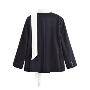 Women's black blazer jacket featuring high-contrast white scarf lapel and sleeve buttons