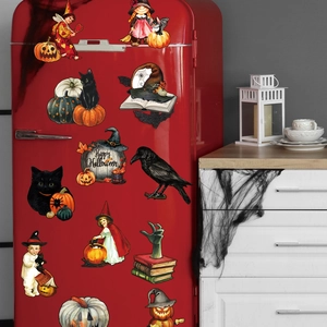 Halloween magnets on a red retro fridge featuring pumpkins, witches and black cats