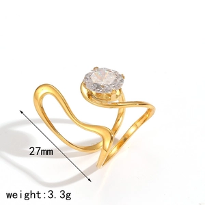 Detail view of irregular gold stainless steel ring with a single round zircon stone