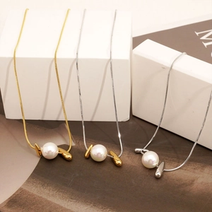 Geometric stainless steel long pearl necklaces with wing pendants on minimalist blocks
