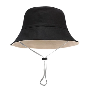 Foldable black bucket hat with off-white lining and adjustable grey windproof chin strap