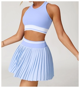 Detail of light blue ribbed sports vest with white stripe hem and elastic fabric texture