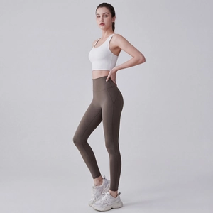 Women high waist seamless yoga set featuring white sports bra and tan leggings