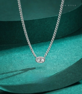 Close-up of S925 sterling silver necklace with oval-cut cubic zirconia pendant
