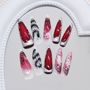 Dark gothic stiletto press-on nails with red smudge and silver centipede patterns