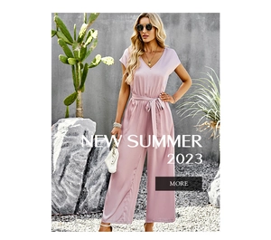 Close-up of a light pink V-neck jumpsuit featuring short sleeves and an elegant belted waist