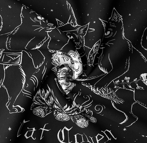 Detailed fabric texture of the black cat coven tapestry with sharp white mystic patterns