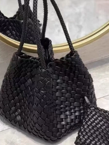 Handwoven black leather bucket bag with matching pouch and knotted handle detail