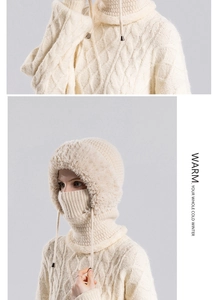 Detail of cream knit balaclava hat with faux fur trim and adjustable drawstrings