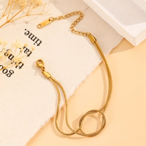 Detail of gold double-layered snake chain bracelet with adjustable lobster clasp closure