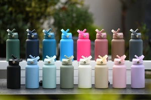 Outdoor shot of 16 colorful 650ml stainless steel sports bottles with matte texture