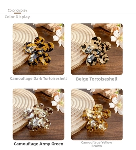 Color variety of floral acetate hair claws in dark tortoise, green and beige shades