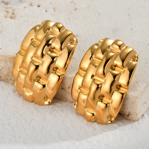 Polished gold stainless steel oval earrings with segmented wave texture on stone