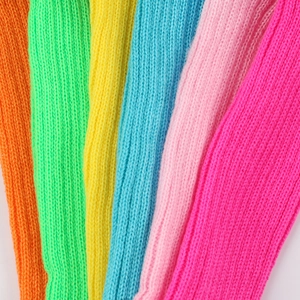 Close-up of colorful knit fabric swatches for warm leg warmers in various vibrant colors