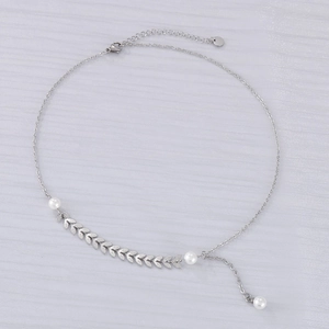 Elegant wheat ear necklace with white pearls on a silver-tone chain shown from above