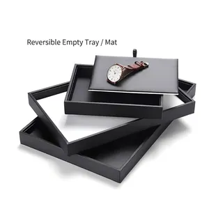 Black jewelry display tray set with reversible leather pads for watch and necklace storage
