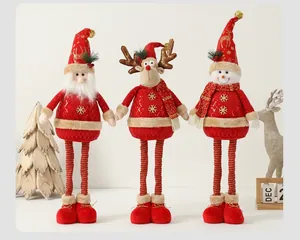 Detailed close-up of plush Santa, Reindeer and Snowman figurines with gold snowflake embroidery