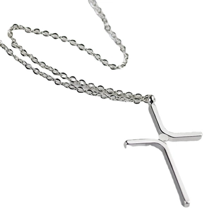 Polished silver stainless steel cross pendant necklace for women on a white background