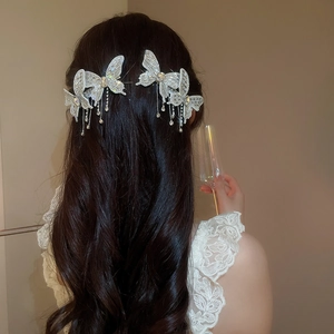 Elegant butterfly hair clips with sparkling rhinestones and delicate tassel charms