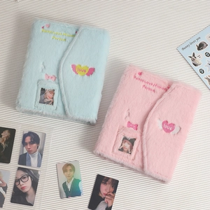 Detail view of plush embroidery photocard albums in light blue and pink with sweet love motifs
