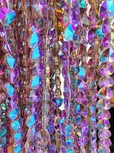 Macro shot of faceted crystal heart beads with AB rainbow coating for jewelry making