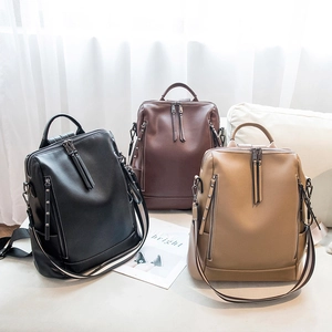 Three large capacity faux leather backpacks in black, dark brown, and khaki for women