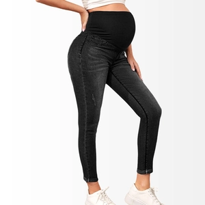 Detail of high waist maternity jeans with elastic belly support band in dark grey