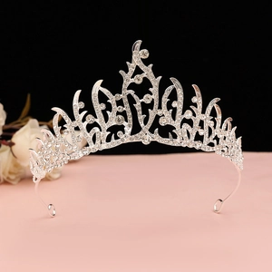Detail view of a luxury Baroque silver tiara with sparkling crystal rhinestones and wave patterns