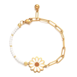 Detail of bohemian daisy charm bracelet with white enamel petals and golden link chain