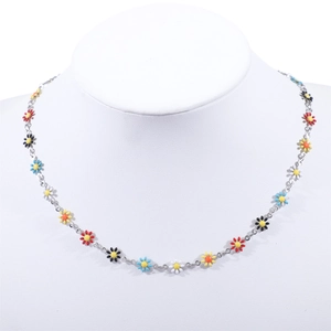 Detailed view of colorful enamel daisy charms on a stainless steel 18K gold chain