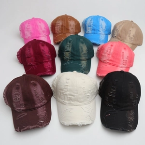Retro washed baseball caps with distressed holes shown in ten trendy assorted colors