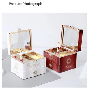 Detail of vintage musical jewelry boxes with spinning ballerina and interior vanity mirrors