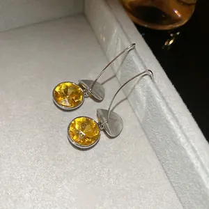 Sparkling silver long hook earrings with vibrant yellow faceted crystal stones for women