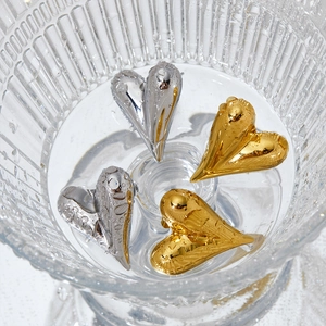Hollow heart stainless steel earrings in gold and silver with water droplet accents