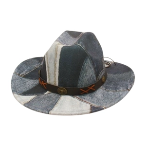 Detail of western patchwork fedora featuring leather band and bull emblem badge