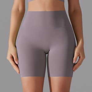 Detail of high waisted seamless athletic shorts in lavender with a wide waistband