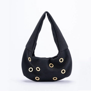 Black suede shoulder bag with gold rivet studs and minimalist hobo style design
