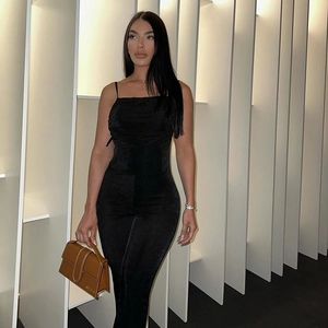 Detail shot of the backless ruched design on this sleek black slim-fit jumpsuit
