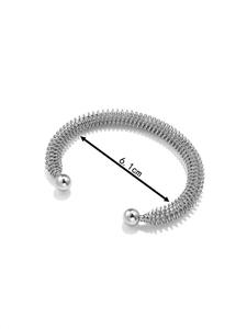 Detail shot of 18K silver spring open bangle with 6.1cm diameter measurement