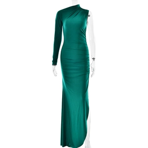 Detailed view of dark green one-shoulder dress with elegant draping and ruched satin texture