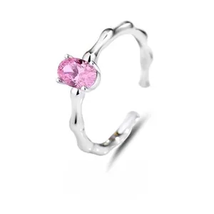 Detail of adjustable S925 silver ring featuring bamboo texture and pink oval gemstone