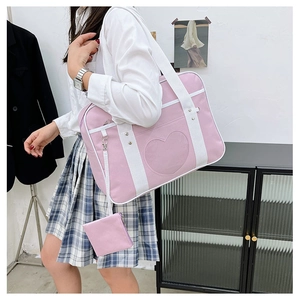 Pink heart-shaped JK uniform messenger bag with wide straps and matching mini coin purse