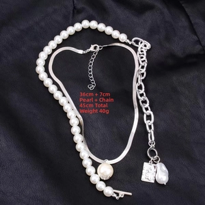 Detail showing 45cm baroque pearl and silver snake chain necklace weighing 40g