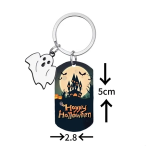 Halloween keychain with ghost pendant and engraved pumpkin castle tag on white background