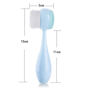 Double-sided facial cleansing brush with soft white bristles and mint green silicone pad